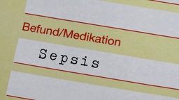 Eine Arbeitsunfähigkeitsbescheinigung mit der Diagnose "Sepsis".